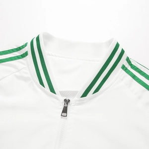 Detail of white track jacket collar with green ribbed knit and shoulder stripes