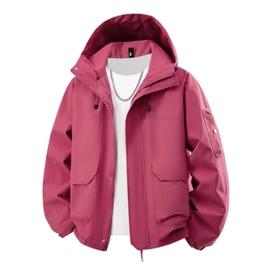 Detail of magenta hooded outdoor jacket with windproof fabric and cargo pockets