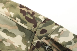 Macro shot of durable camouflage softshell jacket with reinforced seams and tactical zipper