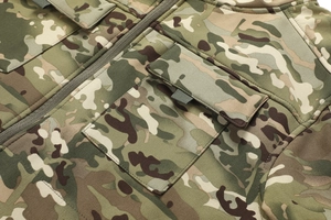 Detail of softshell camo jacket showing tactical flap pockets and durable seam stitching