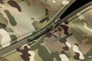 Close-up of military green nylon zipper and puller on Multicam camo softshell jacket