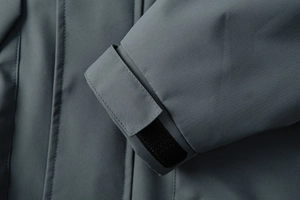 Detailed close-up of adjustable velcro cuff on windproof winter outdoor jacket