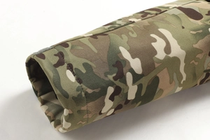 Detail of multi-terrain camouflage tactical jacket cuff with adjustable hook and loop fastener