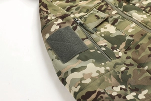 Detail of camouflage tactical jacket featuring a side zipper pocket and velcro patch