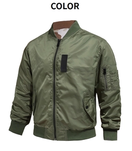Detail view of army green bomber jacket featuring nylon sheen and sleeve utility pocket