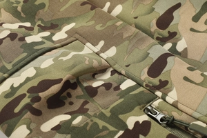 Detailed close-up of Multicam tactical jacket showing durable seams and zipper pocket