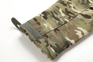 Detail of woodland camo jacket cuff with adjustable velcro strap and rubber pull tab