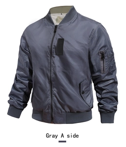 Detail view of the gray bomber jacket featuring a ribbed collar and utility sleeve pocket