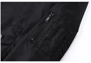 Detail of bomber jacket sleeve pocket with metal zipper and tactical pen slots
