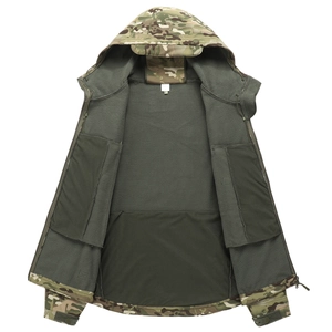 Detail of shark skin tactical jacket with camo pattern and thick green fleece lining