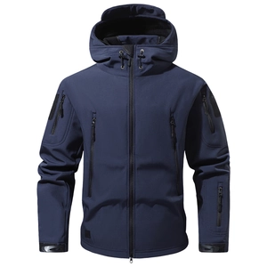 Detail view of navy tactical softshell jacket with windproof pockets and adjustable cuffs