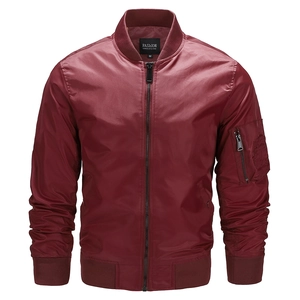 Close-up of wine red bomber jacket featuring ribbed collar and sleeve utility pocket