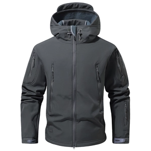 Detail of grey tactical softshell jacket with multi-pocket system and adjustable hood