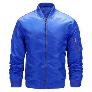 Detail of royal blue bomber jacket with metallic zipper and utility sleeve pocket
