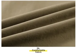 Detailed close-up of soft khaki twill cotton fabric with comfortable breathable texture