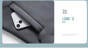 Detailansicht der Seitentasche einer dunkelgrauen Fleecejacke mit Reißverschluss für Handy