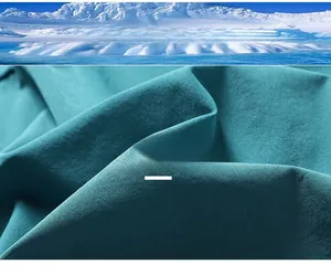 Close-up of cyan breathable athletic shorts fabric showing cool touch texture