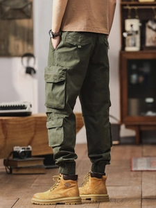 Army green multi-pocket cotton cargo jogger pants for men in a retro stylish design