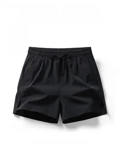 Detail of black athletic shorts featuring elastic waistband, round drawstrings and side slits