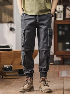 Men's dark grey multi-pocket cotton cargo joggers with elastic cuffs and drawstring waist