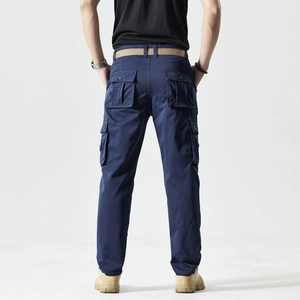 Rear view of navy blue cargo pants with functional flap pockets and khaki belt