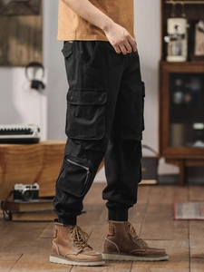 Men's black multi-pocket cargo joggers in breathable cotton, retro tactical workwear style