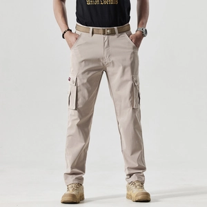 Detail of beige cargo pants with multi-pocket design and durable tactical fabric