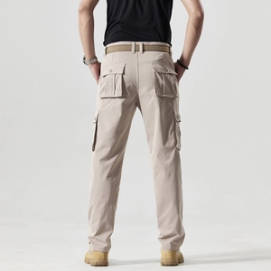 Rear view detail of men's beige cargo pants featuring functional large back flap pockets