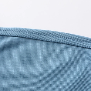Macro detail of the sky blue ice silk fabric texture and reinforced hem stitching