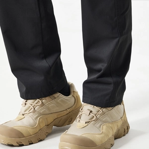 Detail of straight-leg cargo pants cuff paired with breathable mesh tactical outdoor boots