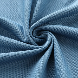 Close-up of breathable blue-grey mesh fabric texture with honeycomb micro-holes for polo shirt