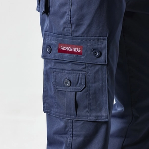 Detailed close-up of functional side cargo pockets with a stylish fashion wear woven label