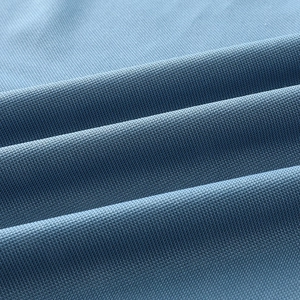Macro shot of breathable ice silk fabric with blue honeycomb mesh texture and soft micro-pores
