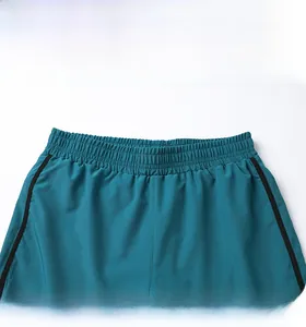 Detail of elastic waistband and black side stripes on quick-dry cyan running shorts