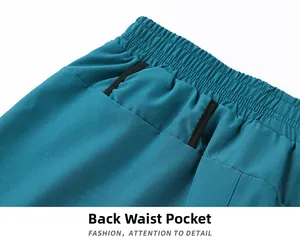 Detail of teal running shorts featuring a functional back waist pocket and elastic band