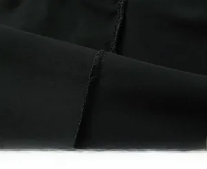 Close-up of high-quality reinforced stitching on black athletic quick-dry running shorts