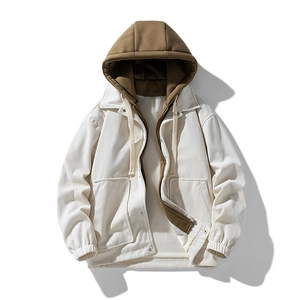 Detail of corduroy hooded jacket with contrast lining and elastic cuffs on white background
