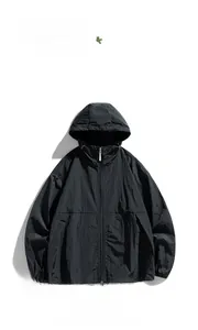 Flat lay of a lightweight black hooded windbreaker with a full zipper and drawstrings