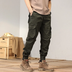 Army green cargo pants for men with elastic waist, multiple pockets and ankle zippers