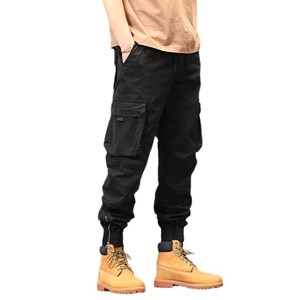 Men's black cargo joggers with elastic waist and side pockets featuring zipper ankle cuffs