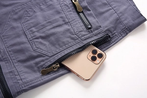 Detailed view of deep grey cotton cargo shorts featuring dual vintage metal zipper pockets