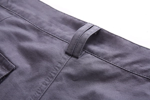 Detailed close-up of grey-blue cotton cargo shorts waistband and reinforced stitching