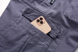 Detail of cargo short large pocket holding a smartphone to show depth and capacity