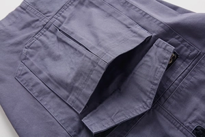 Detail of cargo short pocket with durable stitching and cotton twill fabric texture
