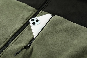 Detail of army green fleece jacket featuring a zippered chest pocket and warm texture
