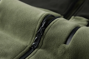 Close-up of olive fleece jacket showing soft texture and high-quality black zipper detail