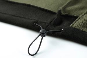 Detail of fleece jacket hem with adjustable elastic drawstring and color blocking