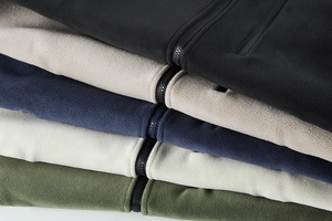 Detail showing five colors of fleece zip-up jackets with high-quality warm fabric texture