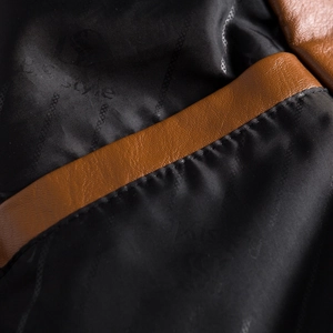 Detail view of the brown leather edge and black satin lining with STYLE logo pattern