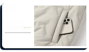 Détail de la grande poche latérale sur une veste de laine matelassée pour homme